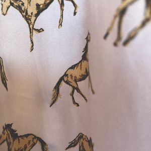 Top shop midi skirt with horses galloping across white background. Side slits.